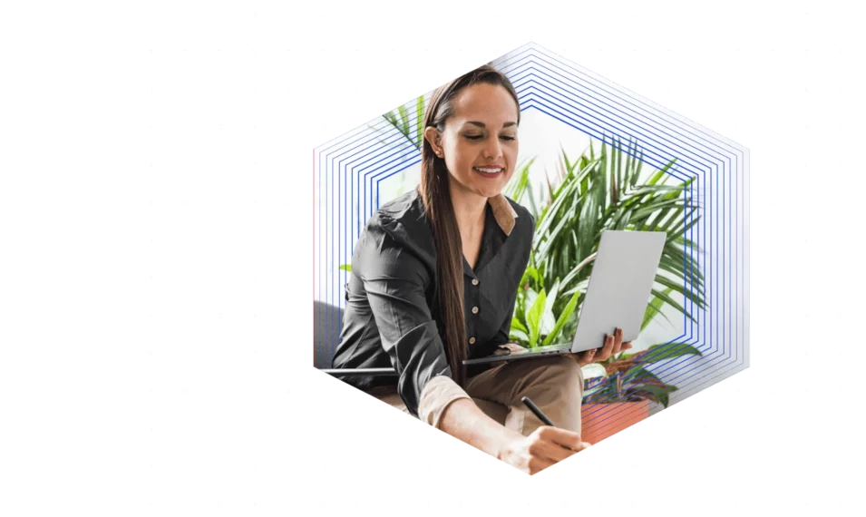 woman on computer with plant